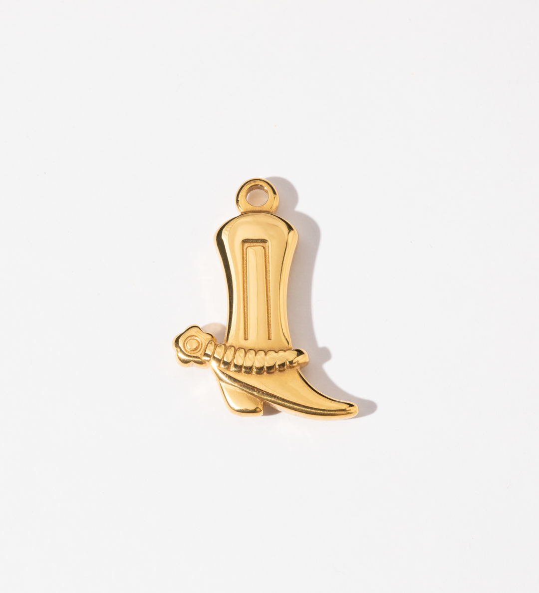 A gold-colored charm in the shape of a classic cowboy boot.