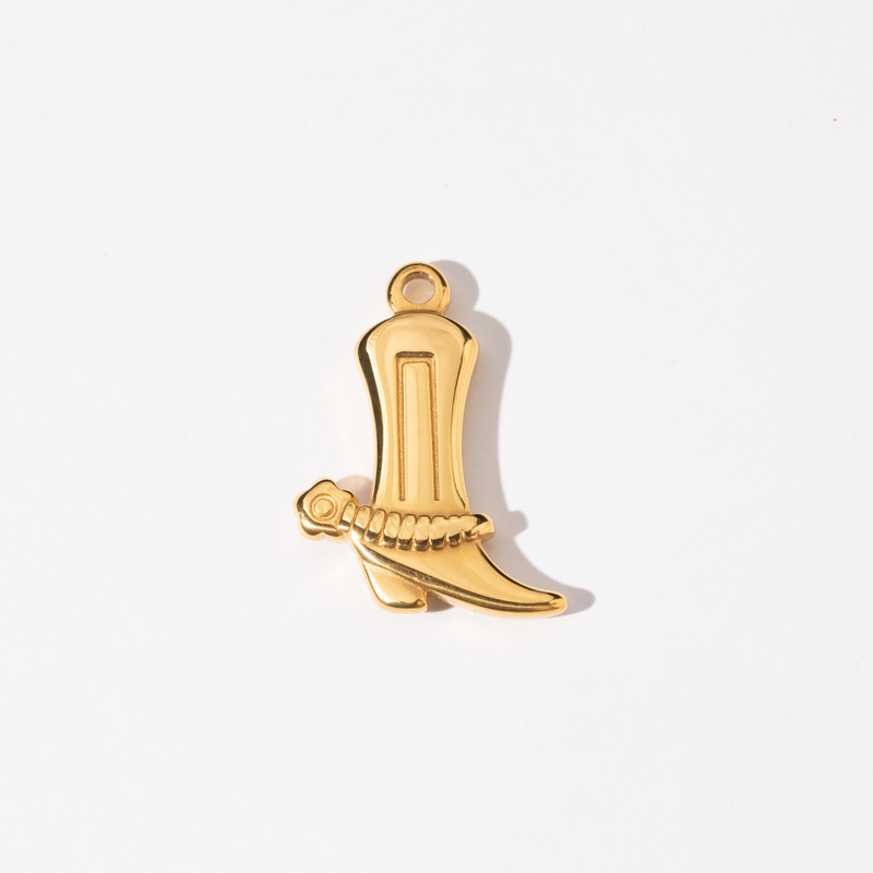 A gold-colored charm in the shape of a classic cowboy boot.