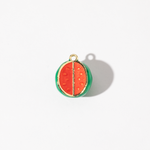A gold-plated stainless steel charm in the shape of a watermelon slice with a glossy finish, featuring vibrant red and green enamel detailing.