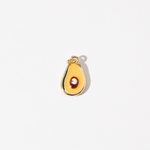 A gold-plated stainless steel charm in the shape of a half-avocado design with a polished seed at the center