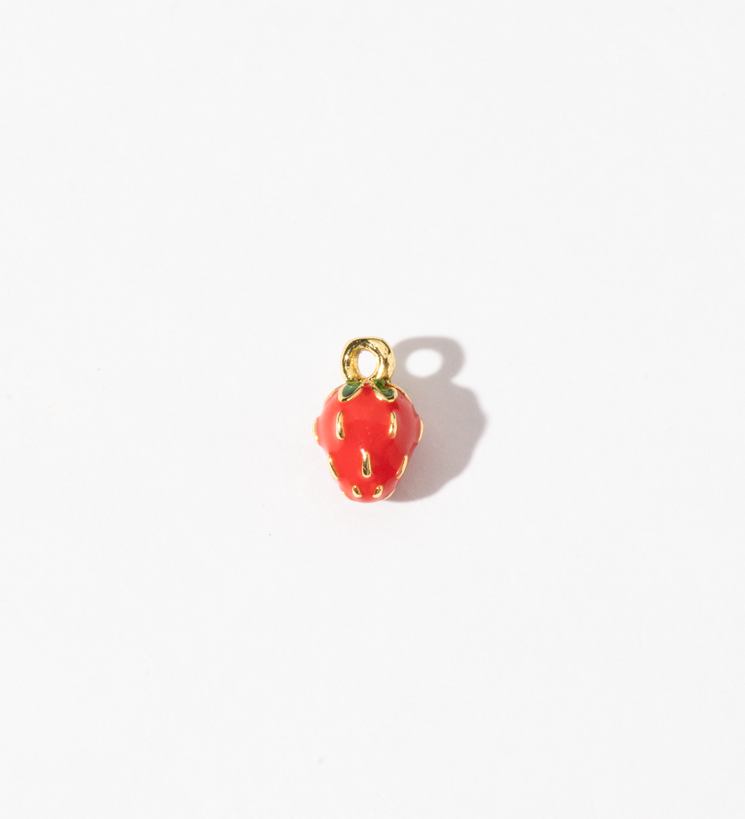 A gold-plated stainless steel charm with a vivid red finish, shaped like a strawberry with subtle details.