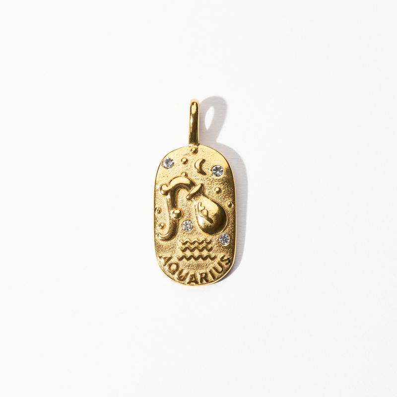 A gold-colored metal medallion charm with an engraved Aquarius symbol and small decorative details.