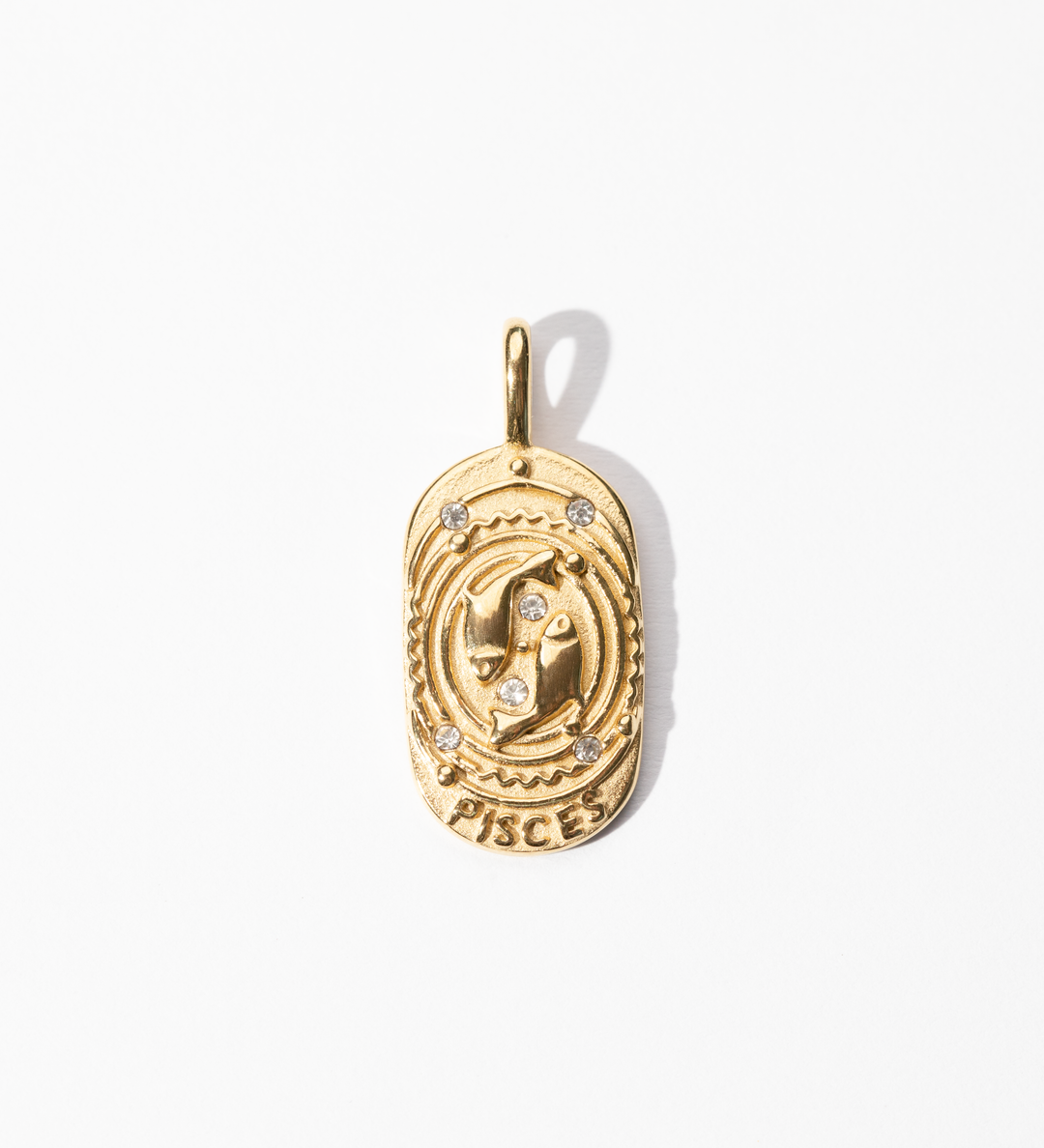 A gold-colored metal medallion charm with the Pisces symbol and small embellishments