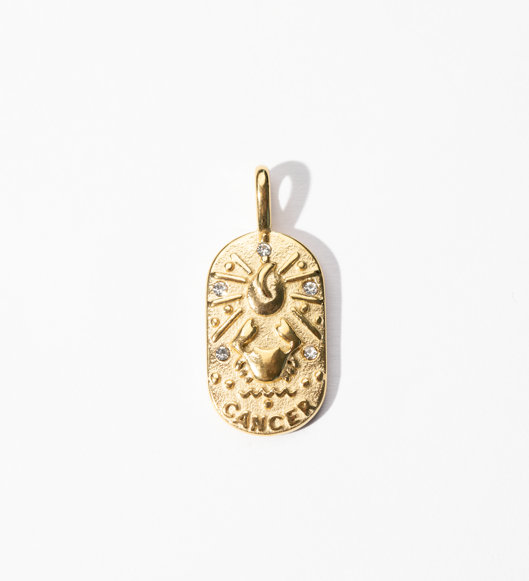 A gold-colored metal medallion charm with a Cancer zodiac symbol, featuring intricate celestial design.