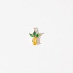 A gold plated stainless steel charm featuring a personalizing of yellow faceted zirconia in the shape of a pineapple with green marquise-cut stones as leaves on a white background.