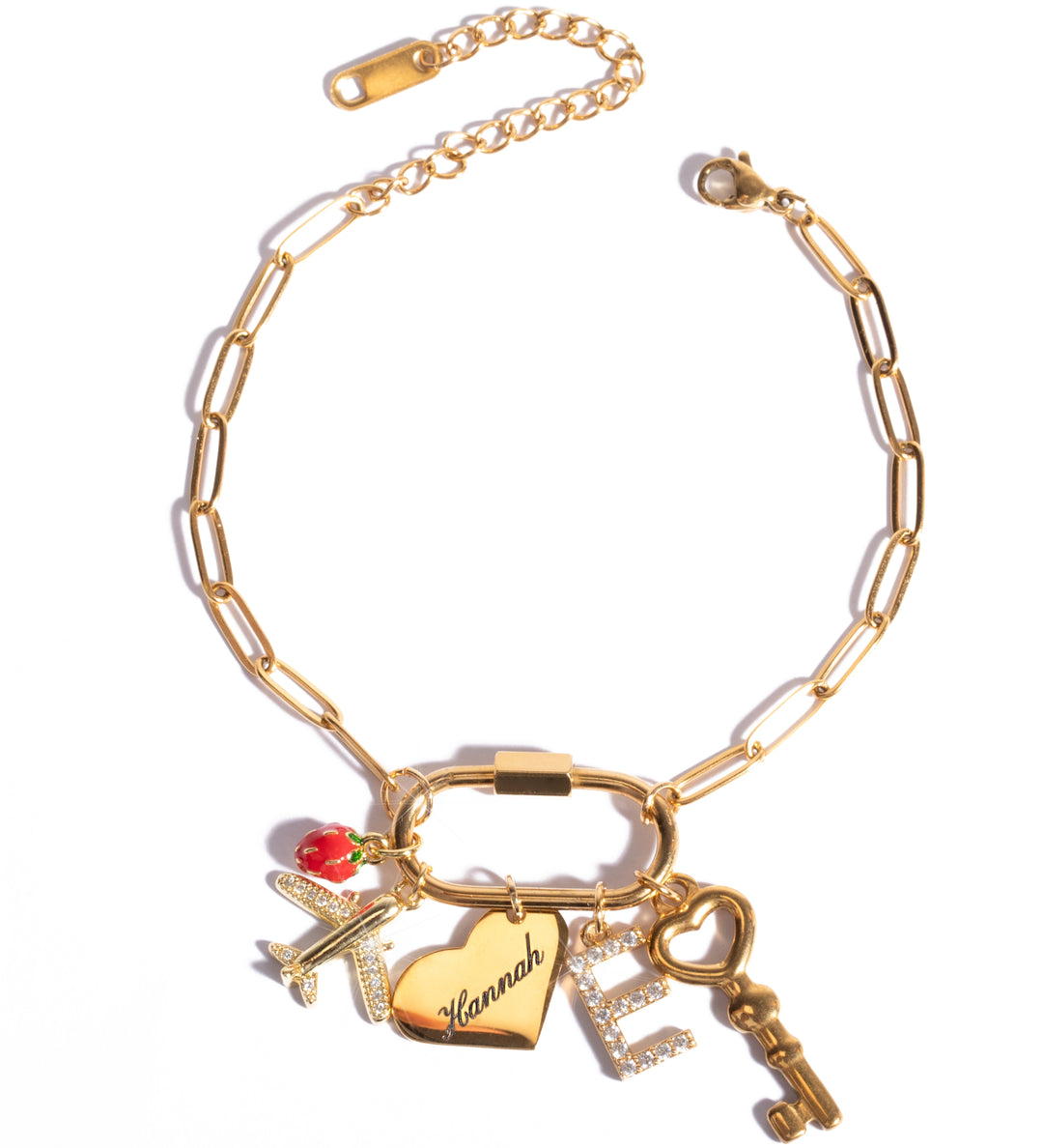 A personalized gold-colored personalized charm bracelet with a carabiner clasp, featuring various charms including a heart and a key.