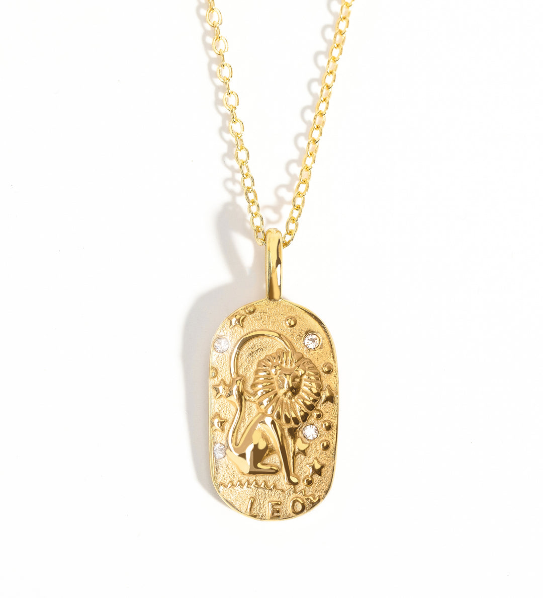 A gold-colored zodiac medallion necklace with a chain.